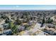 An expansive aerial shot reveals a residential area with mature trees and a sprawling neighborhood layout at 5666 S Havana Ct, Englewood, CO 80111
