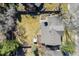 Aerial view of home featuring backyard with hot tub, patio, and mature trees in a quiet neighborhood at 5666 S Havana Ct, Englewood, CO 80111