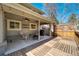 Inviting back patio features a ceiling fan, string lights, fire pit, and comfortable seating. It offers a cozy retreat at 5666 S Havana Ct, Englewood, CO 80111