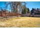 Spacious backyard with a well-manicured lawn and wooden fence, perfect for outdoor activities at 5666 S Havana Ct, Englewood, CO 80111