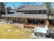 Elevated shot of backyard features a hot tub, deck, and outdoor seating, offering a private retreat at 5666 S Havana Ct, Englewood, CO 80111