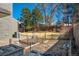 Backyard with garden beds, composters, and well-maintained lawn on a sunny day at 5666 S Havana Ct, Englewood, CO 80111
