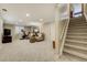 Finished basement features neutral carpet, recessed lighting, exercise bike, and comfortable seating area at 5666 S Havana Ct, Englewood, CO 80111
