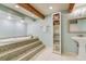 Unique bathroom features a tiled platform tub, modern sink, bright lighting, and fresh ambiance at 5666 S Havana Ct, Englewood, CO 80111