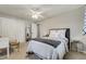 Bedroom showcasing a comfortable bed, mirrored nightstand, plush carpet, and neutral colored walls for a relaxing ambiance at 5666 S Havana Ct, Englewood, CO 80111