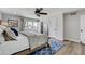 Bright bedroom with hardwood floors, large windows, ceiling fan and closet space at 5666 S Havana Ct, Englewood, CO 80111