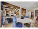 Open concept dining room with backyard views, wooden beams and stylish chair accents at 5666 S Havana Ct, Englewood, CO 80111