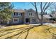 Charming two-story home with neutral gray siding and beautiful landscaping at 5666 S Havana Ct, Englewood, CO 80111