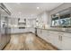 Bright white kitchen with stainless steel appliances and modern countertops at 5666 S Havana Ct, Englewood, CO 80111