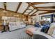 Bright living room with vaulted ceilings, wood paneling, and stylish furniture at 5666 S Havana Ct, Englewood, CO 80111