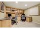 Spacious office with custom built-ins, granite countertops, and comfortable chairs perfect for working from home at 5666 S Havana Ct, Englewood, CO 80111