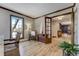 Bright and airy office space with hardwood floors, wooden trim and natural light from the large window at 5666 S Havana Ct, Englewood, CO 80111