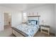 Cozy bedroom with a large bed, neutral walls, and natural light at 13408 Wabash St, Thornton, CO 80602