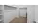 This walk-in closet has ample storage with rods and shelving at 13408 Wabash St, Thornton, CO 80602