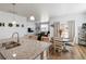 Modern kitchen with granite countertops, stainless steel sink, and open layout to the dining area at 13408 Wabash St, Thornton, CO 80602