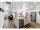 Bright kitchen with granite counters and stainless appliances opens to the living area at 13408 Wabash St, Thornton, CO 80602