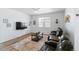 Comfortable living room with large screen tv and two leather reclining sofas at 13408 Wabash St, Thornton, CO 80602