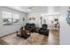 Comfortable living room with plush seating, a ceiling fan, and a bright window at 13408 Wabash St, Thornton, CO 80602
