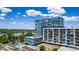 Aerial image of a high-rise building featuring a rooftop pool and views of the surrounding lake at 4200 W 17Th Ave # 625, Denver, CO 80204