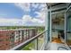 Balcony view showcasing city landscape, a nearby park and mountains in the background at 4200 W 17Th Ave # 625, Denver, CO 80204