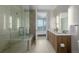 Bathroom view with a glass shower, double sink vanity and mountain view at 4200 W 17Th Ave # 625, Denver, CO 80204