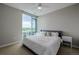 Bright bedroom with large window offering mountain views and a ceiling fan at 4200 W 17Th Ave # 625, Denver, CO 80204