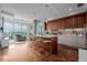 Bright kitchen featuring a large island with seating and modern wood cabinetry at 4200 W 17Th Ave # 625, Denver, CO 80204