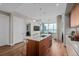 Bright kitchen featuring island seating and an open floor plan with city views at 4200 W 17Th Ave # 625, Denver, CO 80204