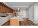Open kitchen boasts an island with seating, stainless appliances, and wood accents at 4200 W 17Th Ave # 625, Denver, CO 80204