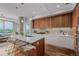 Open-concept kitchen with an island, sleek cabinetry, and modern appliances at 4200 W 17Th Ave # 625, Denver, CO 80204