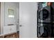 Compact laundry area with a stacked washer and dryer, and additional storage space at 4200 W 17Th Ave # 625, Denver, CO 80204