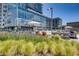 Exterior view showing an outdoor pool, sun loungers, and manicured landscaping with a modern building backdrop at 4200 W 17Th Ave # 625, Denver, CO 80204