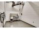 Pet washing station with stainless steel tub, cleaning supplies, and a vacuum cleaner at 4200 W 17Th Ave # 625, Denver, CO 80204