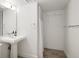 Bathroom with a classic pedestal sink and walk-in shower with white tiling and shower curtain at 2025 Ash St, Denver, CO 80207