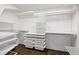Spacious walk-in closet with custom shelving, drawers, and hanging rods, offering ample storage space and organization at 2025 Ash St, Denver, CO 80207
