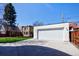 Detached one car garage with a large driveway at 2025 Ash St, Denver, CO 80207