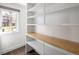 Bright home office featuring a window and a built-in desk with wooden countertop at 2025 Ash St, Denver, CO 80207