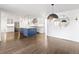 Bright, open kitchen layout with a large island, stainless appliances, and hardwood flooring at 2025 Ash St, Denver, CO 80207