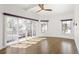 Bright and airy bedroom featuring beautiful floors, lots of natural light, and a door to a private balcony at 2025 Ash St, Denver, CO 80207