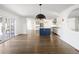 Bright, open floorplan with kitchen, dining area, and a view of the outdoor living space at 2025 Ash St, Denver, CO 80207