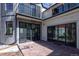 Back of house features an outdoor patio space with dark frame glass doors at 2025 Ash St, Denver, CO 80207