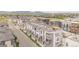 Aerial view of newly built townhomes showcases modern architecture and community design with mountain views at 2282 Old Rail Way, Superior, CO 80027