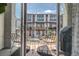 Inviting balcony with seating, offering a pleasant view of the neighborhood townhomes at 2282 Old Rail Way, Superior, CO 80027