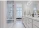 The bathroom has a tiled glass shower and double sink vanity that connects to the main bedroom at 2282 Old Rail Way, Superior, CO 80027
