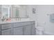 The bathroom has gray cabinets, a quartz countertop, stainless steel hardware, and a modern toilet at 2282 Old Rail Way, Superior, CO 80027