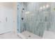 The bathroom showcases a tiled glass shower with a modern shower head and stylish blue tiling at 2282 Old Rail Way, Superior, CO 80027
