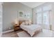 Comfortable bedroom features a queen-sized bed, soft lighting, and tranquil color palette at 2282 Old Rail Way, Superior, CO 80027