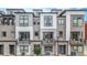 Modern townhome exterior with multiple levels, balconies, and contemporary design elements at 2282 Old Rail Way, Superior, CO 80027