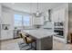 Bright kitchen features a large island, stainless appliances, and ample storage at 2282 Old Rail Way, Superior, CO 80027