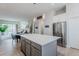 Open concept kitchen area with a large island, stainless steel appliances and modern accents at 2282 Old Rail Way, Superior, CO 80027